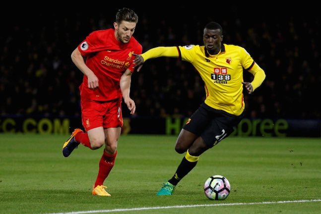 Liverpool's Adam Lallana in action with Watford's MBaye Niang
