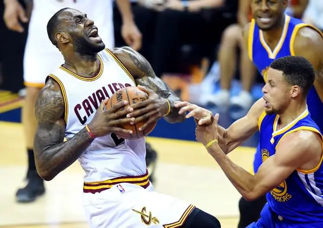 Jun 10, 2016; Cleveland, OH, USA; Cleveland Cavaliers forward LeBron James (23) drives to the basket against Golden State Warriors guard Stephen Curry (30) during the first quarter in game four of the NBA Finals at Quicken Loans Arena.