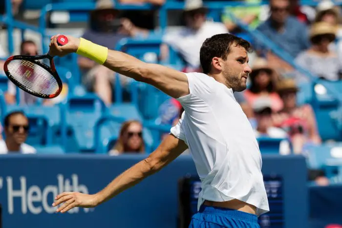 Grigor Dimitrov (BUL) returns a serve during the semifinal round at the 2017 Western & Southern Open tennis tournament being played at the Linder Family Tennis Center in Mason, Ohio.
