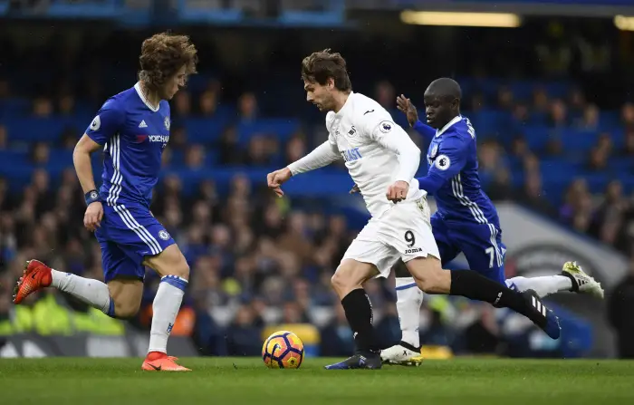 Britain Football Soccer - Chelsea v Swansea City - Premier League - Stamford Bridge - 25/2/17 Swansea City's Fernando Llorente in action with Chelsea's N'Golo Kante and David Luiz