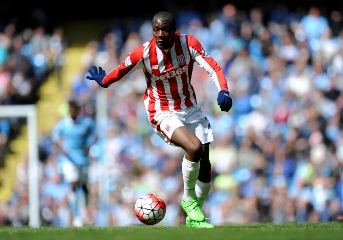 As temperatures rose during the day and bright sunshine at the Etihad Gianelli Imbula of Stoke City continues to wear wooly gloves even after going 4-0 down during the Barclays Premier League match between Manchester City and Stoke City at The Etihad Stadium, Manchester on the 22nd of April 2016