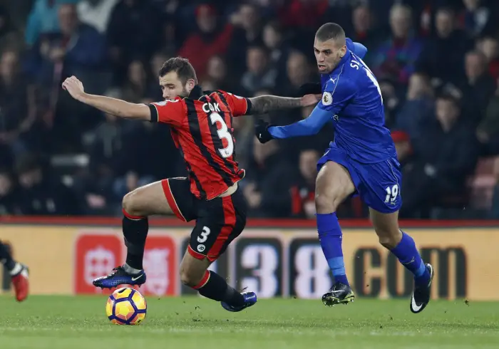 Britain Football Soccer - AFC Bournemouth v Leicester City - Premier League - Vitality Stadium - 13/12/16 Bournemouth's Steve Cook in action with Leicester City's Islam Slimani