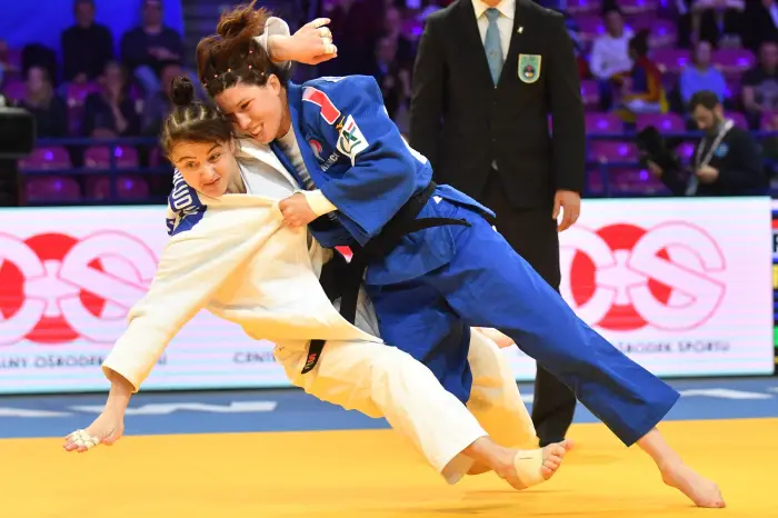 Irina Zabludina (white) of Russia and Helene Receveaux (blue) of France are seen in action during the bronze medal fight in the -57 kg women category, during the first day of the European Judo Championships 2017 at Torwar Hall in Warsaw, Poland, 20 April 2017. Helene Receveaux won the bronze medal.