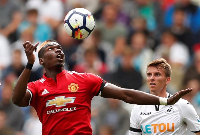 Manchester United's Paul Pogba in action with Swansea City's Tom Carroll