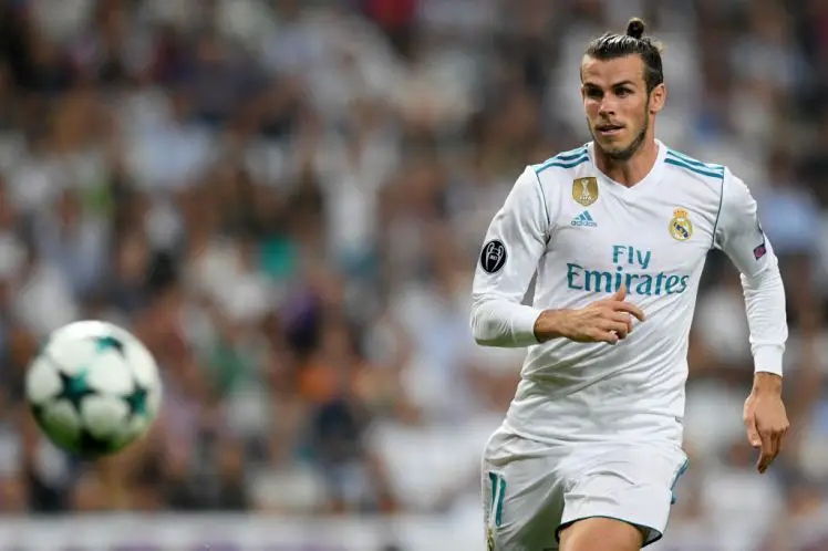 Real Madrid's Welsh forward Gareth Bale runs for the ball during the UEFA Champions League football match Real Madrid CF vs APOEL FC at the Santiago Bernabeu stadium in Madrid on September 13, 2017. / AFP PHOTO / GABRIEL BOUYS        (Photo credit should read GABRIEL BOUYS/AFP/Getty Images)