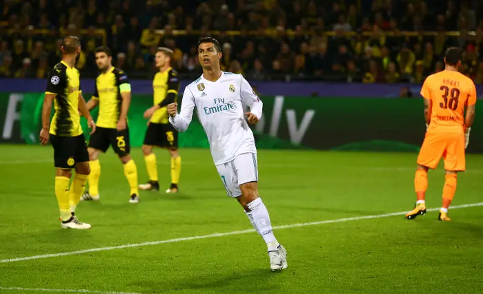 Real Madrid¹s Cristiano Ronaldo celebrates their first goal scored by Gareth Bale, as Borussia Dortmund¹s Roman Burki looks dejected