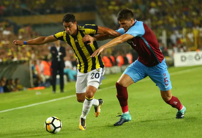 Guiliano (L) of Fenerbahce and Okay Yokuslu  of Trabzonspor  during the Turkey Superlig match between Fenerbahce and Trabzonspor at Sukru Saracoglu Stadium in Istanbul , Turkey on August 20 , 2017.
Final Scores : Fenerbahce 2 - Trabzonspor 2