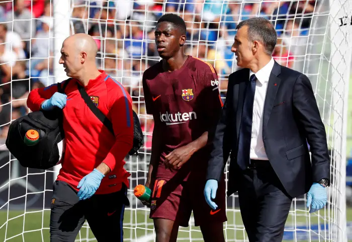 Soccer Football - Santander La Liga - Getafe CF vs FC Barcelona - Coliseum Alfonso Perez, Getafe, Spain - September 16, 2017   Barcelona's Ousmane Dembele receives medical attention after sustaining an injury