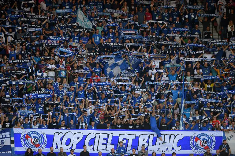 Strasbourg's supporters cheer during the French Ligue 1 football match between Strasbourg (RCSA) and Nantes (FCNA) on September 24, 2017 at the Meinau stadium in Strasbourg, eastern France.  / AFP PHOTO / PATRICK HERTZOG