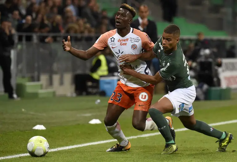 Montpellier's French defender Nordi Mukiele (L) vies with Saint-Etienne's French forward Kevin Monnet-Paquet R) during the French L1 football match Saint-Etienne (ASSE) vs Montpellier (MHSC) on October 20, 2017, at the Geoffroy Guichard Stadium in Saint-Etienne.  / AFP PHOTO / JEAN-PHILIPPE KSIAZEK