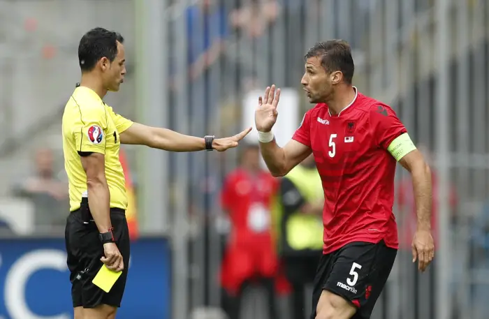 Football Soccer - Albania v Switzerland - EURO 2016 - Group A - Stade Bollaert-Delelis, Lens, France - 11/6/16
Albania's Lorik Cana is booked by referee Carlos Velasco