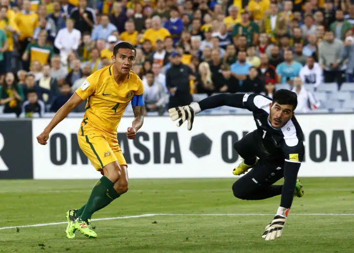 Australia's Tim Cahill looks on as he scores against Syria's Ibrahim Alma