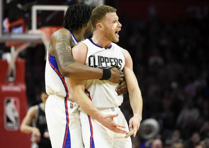 LA Clippers forward Blake Griffin (32) reacts after a shot in front of as center DeAndre Jordan (6)