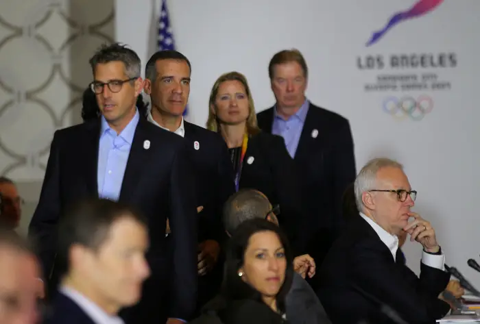 Los Angeles Mayor Eric Garcetti (C) joins with LA 2024 chairman Casey Wasserman (L), U.S. IOC member Angela Ruggiero and United States Olympic Committee chairman Larry Probst (R)