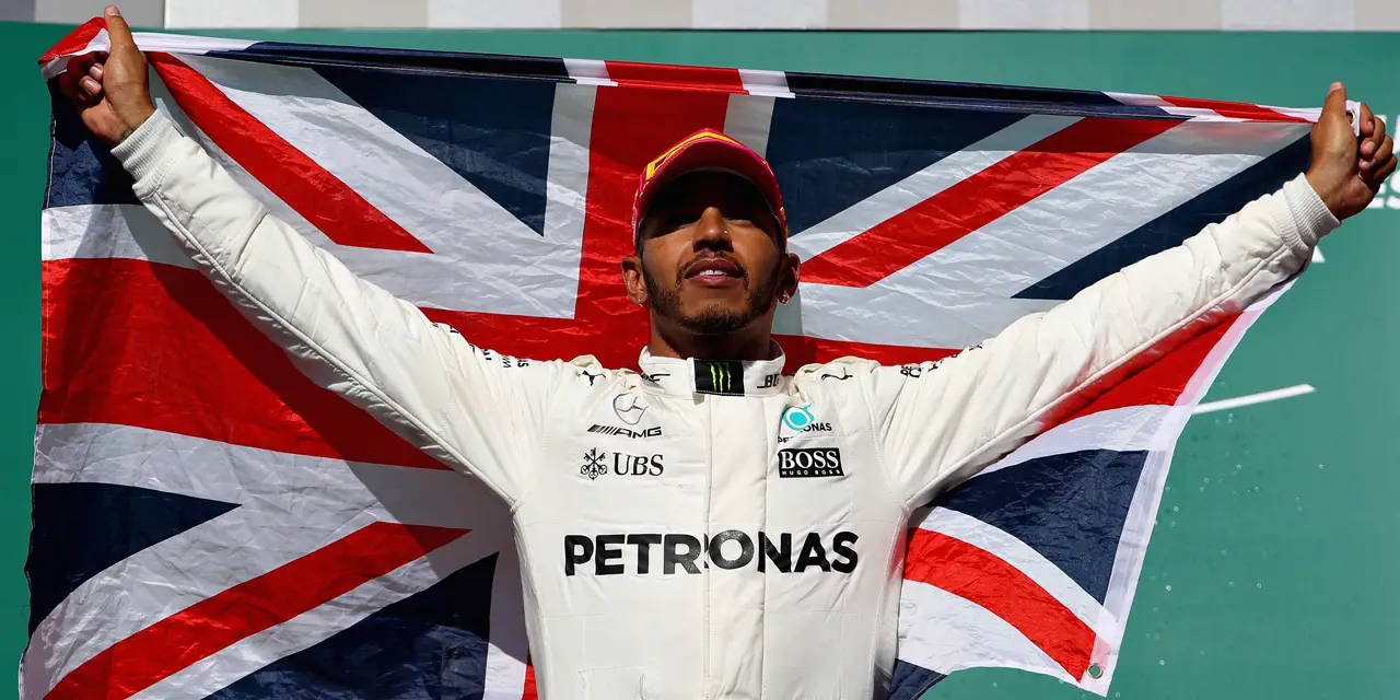 AUSTIN, TX - OCTOBER 22: Race winner Lewis Hamilton of Great Britain and Mercedes GP celebrates on the podium during the United States Formula One Grand Prix at Circuit of The Americas on October 22, 2017 in Austin, Texas.   Clive Mason/Getty Images/AFP