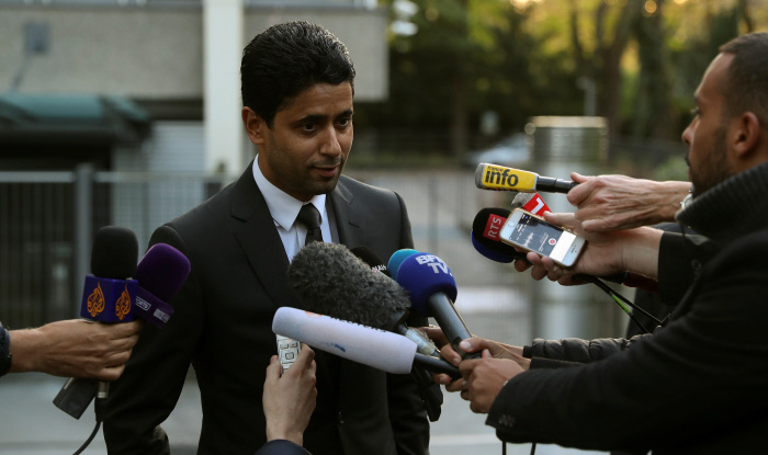 Nasser Al-Khelaifi (R), CEO of Qatar's beIN Media and president of French soccer club Paris St Germain (PSG) talks to the media after he was questioned as part of a criminal investigation into World Cup broadcasting deals, in Bern