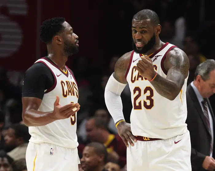 October 17, 2017 - Cleveland, OH, USA - The Cleveland Cavaliers' Dwyane Wade, left, and LeBron James have a discussion before resuming play in the third quarter against the Boston Celtics on Tuesday, Oct. 17, 2017, at Quicken Loans Arena in Cleveland.
