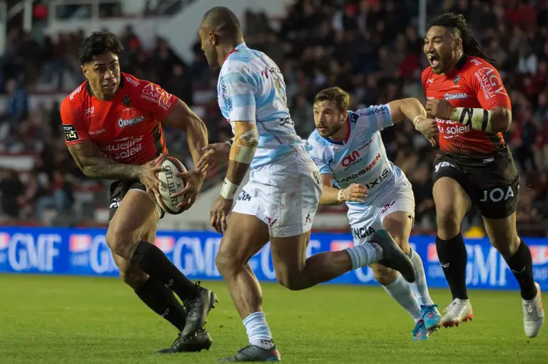 RC Toulon's New Zealand centre Malakai Fekitoa (L) runs with the ball from Racing92's New Zealand winger Joe Rokocoko (2L) and Racing92's winger Marc Andreu (2R) as team-mate RC Toulon's New Zealand centre Maa Nonu shouts during the French Top 14 rugby union match RC Toulon vs Racing 92 at the Mayol stadium in Toulon, southeastern France on November 19, 2017.  / AFP PHOTO / BERTRAND LANGLOIS