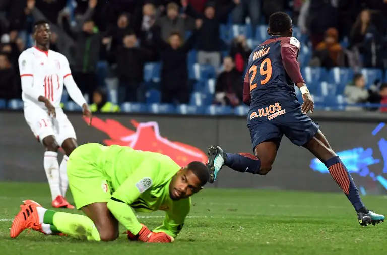 Montpellier's Chadian forward Casimir Ninga (R) reacts after scoring a goal during the French L1 football match between MHSC Montpellier and Lille, on November 25, 2017 at the La Mosson Stadium in Montpellier, southern France. / AFP PHOTO / PASCAL GUYOT