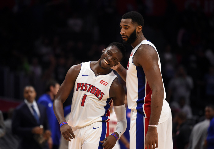 LOS ANGELES, CA - OCTOBER 28: Detroit Pistons Guard Reggie Jackson (1) and Detroit Pistons Center Andre Drummond (0) celebrate the victory during an NBA game between the Detroit Pistons and the Los Angeles Clippers on October 28, 2017 at STAPLES Center in Los Angeles, CA.