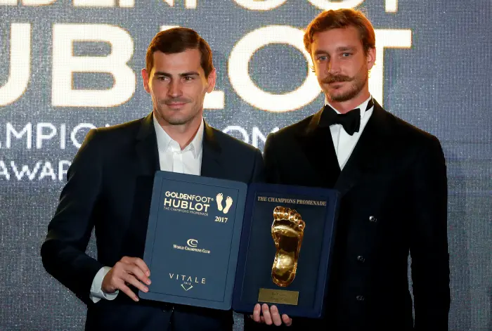 Iker Casillas poses after receiving his Golden Foot Award from Pierre Casiraghi