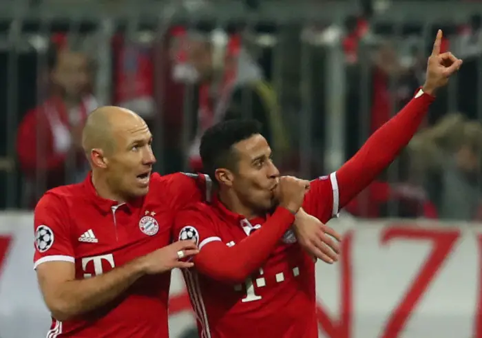 Bayern Munich's Thiago Alcantara celebrates scoring their third goal with Arjen Robben