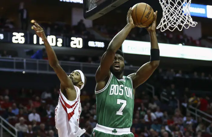 Dec 5, 2016; Houston, TX, USA; Boston Celtics forward Jaylen Brown (7) scores a basket as Houston Rockets forward Corey Brewer (33) defends during the second quarter at Toyota Center.