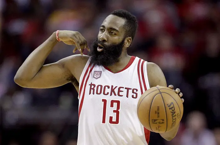 Mar 20, 2017; Houston, TX, USA; Houston Rockets guard James Harden (13) dribbles against the Denver Nuggets in the second quarter at Toyota Center.