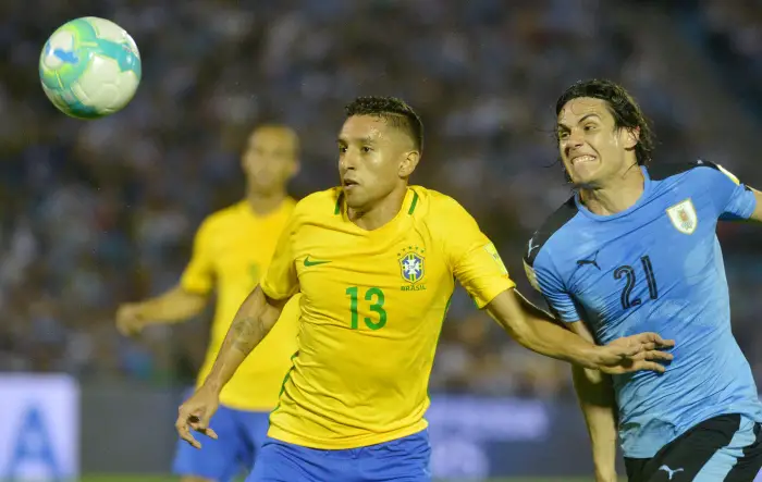 Uruguay's Edinson Cavani (21) and Brazil's Marquinhos