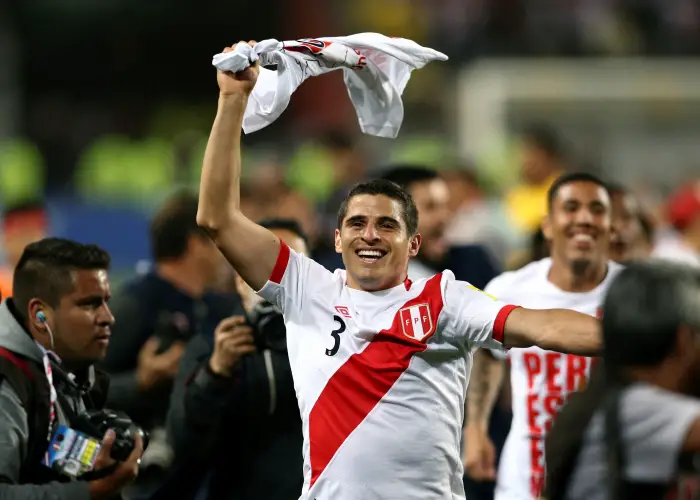 Peru's Aldo Corzo celebrates after his team won the match.
