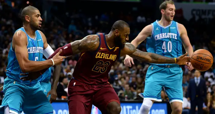 November 15, 2017 - Charlotte, NC, USA - The Cleveland Cavaliers' Lebron James, right, tries to get a hand on a loose ball as the Charlotte Hornets' Nicolas Batum attempts to stop James in the second half on Wednesday, Nov. 15, 2017, at the Spectrum Center in Charlotte, N.C. The Cavaliers won, 115-107.
