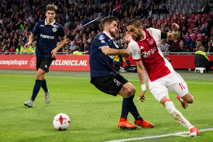 AMSTERDAM - 14-10-2017 , voetbal , Eredivisie , Johan Cruijff Arena , seizoen 2017 / 2018 , Ajax - Sparta , Sparta speler Frederik Holst (l) Ajax speler Hakim Ziyech (r)