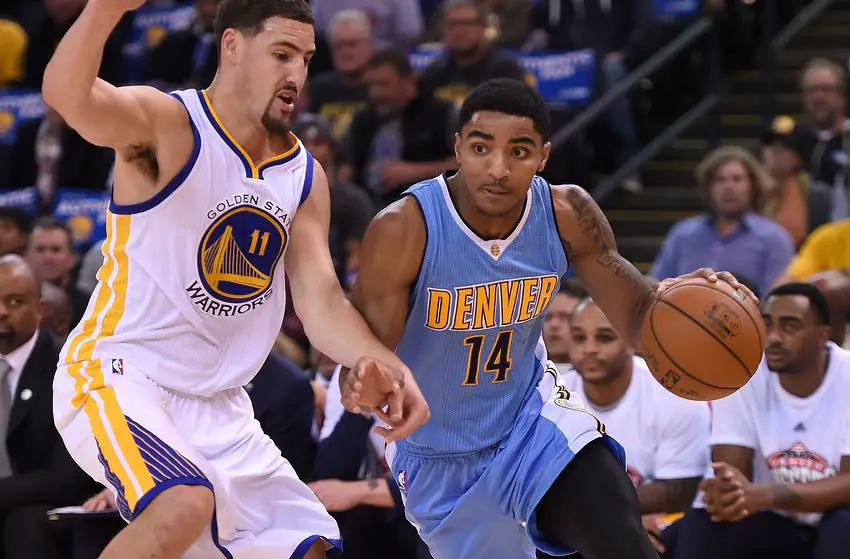 OAKLAND, CA - NOVEMBER 06:  Gary Harris #14 of the Denver Nuggets drives on Klay Thompson #11 of the Golden State Warriors during their NBA basketball game at ORACLE Arena on November 6, 2015 in Oakland, California. NOTE TO USER: User expressly acknowledges and agrees that, by downloading and or using this photograph, User is consenting to the terms and conditions of the Getty Images License Agreement.  (Photo by Thearon W. Henderson/Getty Images)