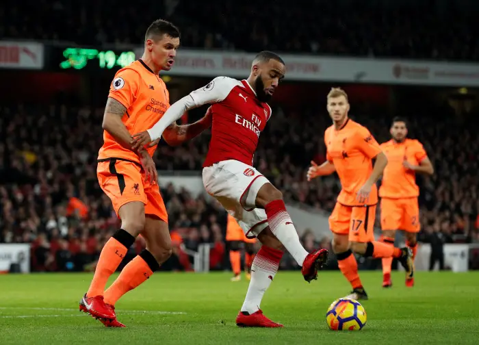 Soccer Football - Premier League - Arsenal vs Liverpool - Emirates Stadium, London, Britain - December 22, 2017   Arsenal's Alexandre Lacazette in action with Liverpool's Dejan Lovren