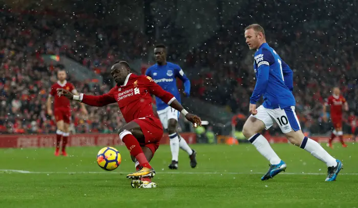Soccer Football - Premier League - Liverpool vs Everton - Anfield, Liverpool, Britain - December 10, 2017   Liverpool's Sadio Mane slips as he is in action with Everton's Wayne Rooney