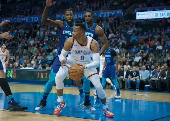 OKLAHOMA CITY, OK - DECEMBER 11:  Oklahoma City Thunder Guard Russell Westbrook (0) looks for a play versus Charlotte Hornets on December 11, 2017 at the Chesapeake Energy Arena in Oklahoma City, OK.