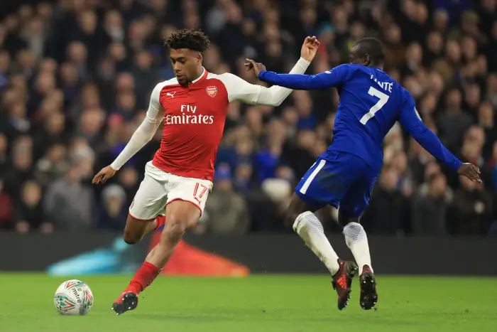 10th January 2018, Stamford Bridge, London, England; Carabao Cup football, semi final, 1st leg, Chelsea versus Arsenal; Alex Iwobi of Arsenal is under pressure from Ngolo Kante of Chelsea