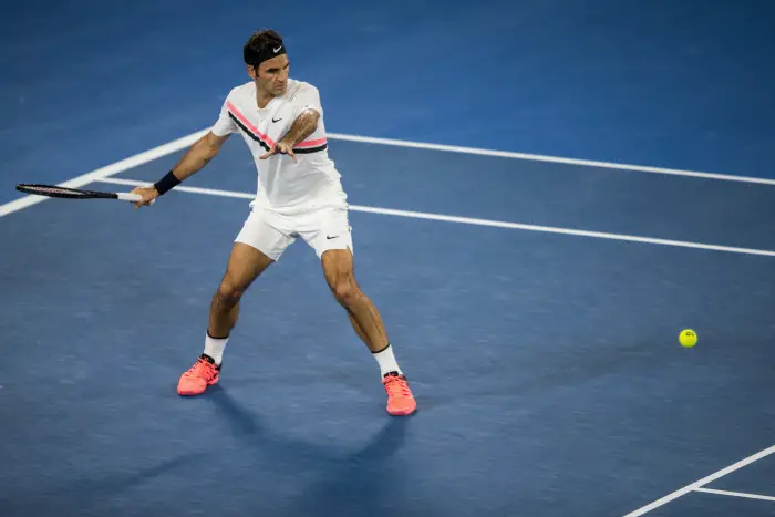 MELBOURNE, VIC - JANUARY 20: Roger Federer of Switzerland plays a shot in his third round match during the 2018 Australian Open on January 20, 2018, at Melbourne Park Tennis Centre in Melbourne, Australia.