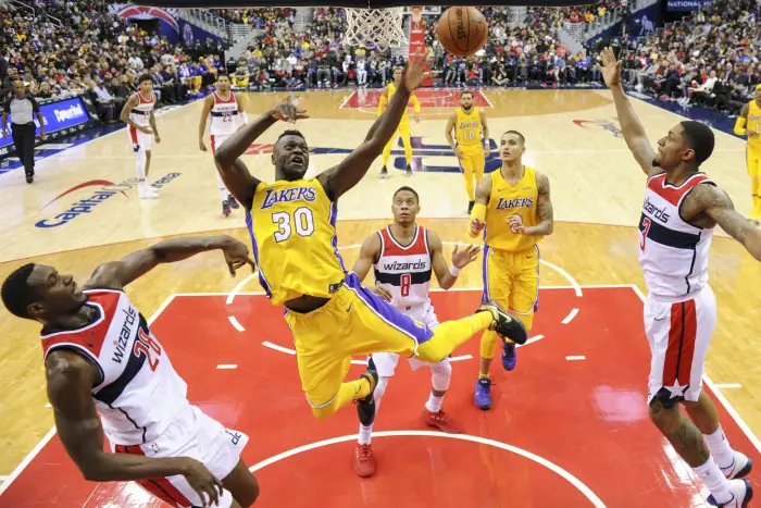 Los Angeles Lakers forward Julius Randle (30) is fouled by Washington Wizards center Ian Mahinmi (28)