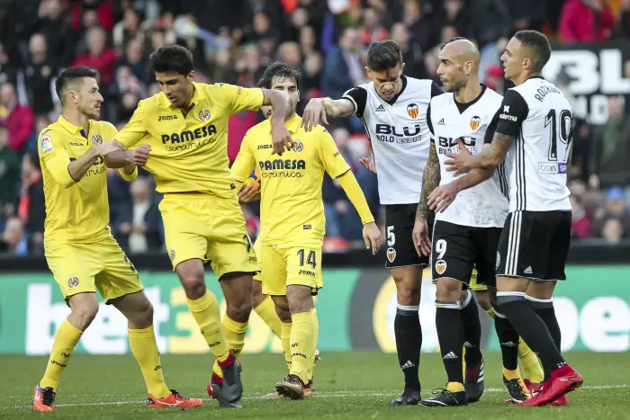 Rodrigo Hernandez of Villarreal CF (C) and Gabriel Paulista  of Valencia CF reacts  during spanish La Liga match between Valencia CF vs Villarreal CF   at Mestalla  Stadium on  December  23, 2017.