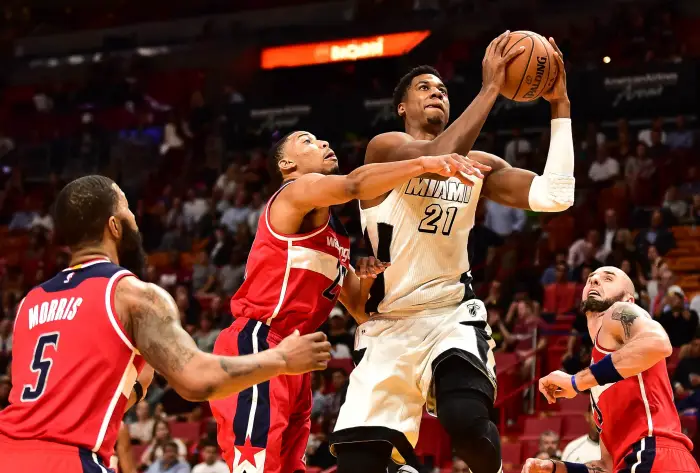 Dec 12, 2016; Miami, FL, USA; Washington Wizards forward Otto Porter Jr. (22) applies pressure to Miami Heat center Hassan Whiteside (21) during the first half at American Airlines Arena.