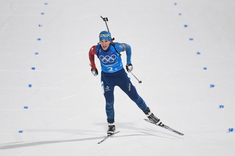 France's Anais Bescond skis to cross the finish line in the women's 4x6km biathlon event during the Pyeongchang 2018 Winter Olympic Games on February 22, 2018, in Pyeongchang. / AFP PHOTO / Jonathan NACKSTRAND
