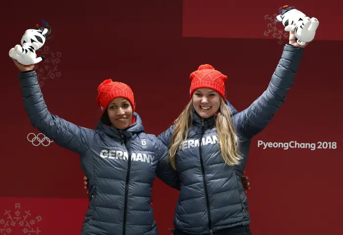 Pyeongchang 2018 Winter Olympics - Women's Finals - Olympic Sliding Centre - Pyeongchang, South Korea - February 21, 2018 - Gold medalists Mariama Jamanka and Lisa Buckwitz of Germanycelebrate during the victory ceremony.