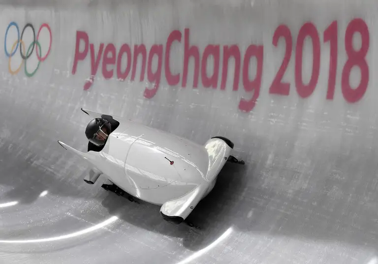 Russia's team leader and driver Nadezhda Sergeeva takes a turn in the first women's unofficial bobsleigh training session during the Pyeongchang 2018 Winter Olympic Games, at the Olympic Sliding Centre on February 7, 2018 in Pyeongchang.  / AFP PHOTO / Mark Ralston