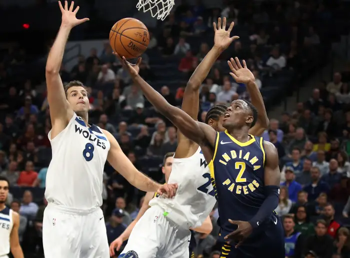 October 24, 2017 - Minneapolis, MN, USA - The Indiana Pacers' Darren Collison (2) scores over the Minnesota Timberwolves' Nemanja Bjelica (8) and Andrew Wiggins in the second half at Target Center in Minneapolis on Tuesday, Oct. 24, 2017. The Pacers won, 130-107.
