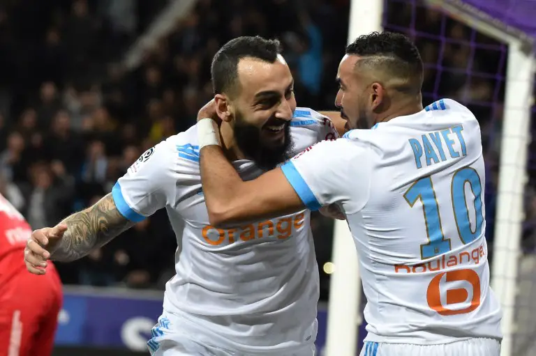 Marseille's Greek forward Konstantinos Mitroglou (L) celebrates with Marseille's French midfielder Dimitri Payet (R) after scoring a goal during the French L1 football match between Toulouse (TFC) and Marseille (OM) March 11, 2018, at the Municipal Stadium in Toulouse, southern France. / AFP PHOTO / PASCAL PAVANI