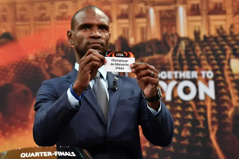 French former football player for Barcelona and Lyon Eric Abidal shows the slip of Olympique de Marseille during the draw for the quarter finals round of the UEFA Europa League football tournament at the UEFA headquarters in Nyon, on March 16, 2018. / AFP PHOTO / Fabrice COFFRINI
