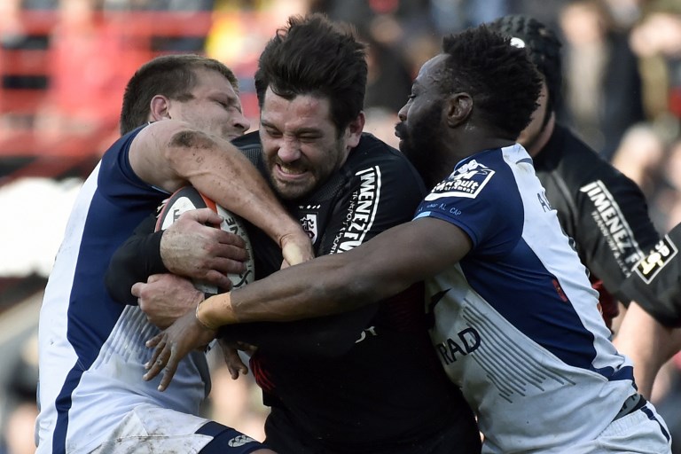 Toulouse's French centre Florian Fritz (C) vies for the ball against Montpellier's players during the French Top 14 rugby union match between Toulouse and Montpellier, on March 18, 2018 at the Ernest Wallon Stadium in Toulouse, southern France. / AFP PHOTO / PASCAL PAVANI