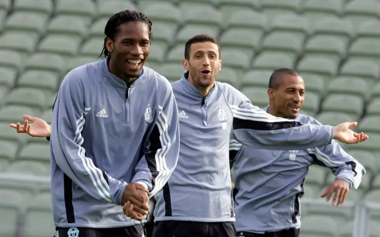 (From L-R) Marseille's forward Didier Drogba, captain Brahim Hemdani and forward Steve Marlet take part in a training session on the eve of the UEFA final football match against Valencia at the Ullevi stadium in Gothenburg, 18 May 2004. AFP PHOTO/GERARD JULIEN / AFP PHOTO / GERARD JULIEN