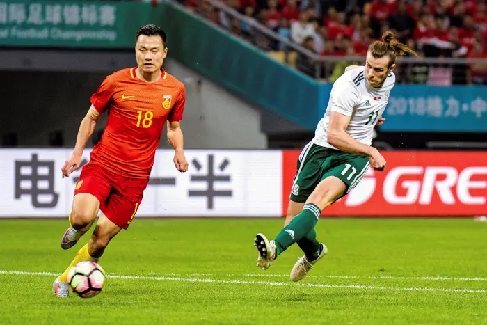 Football Soccer - China v Wales - China Cup Semi-Finals - Guangxi Sports Center, Nanning, China - March 22, 2018 Gareth Bale of Wales (R) in action.
